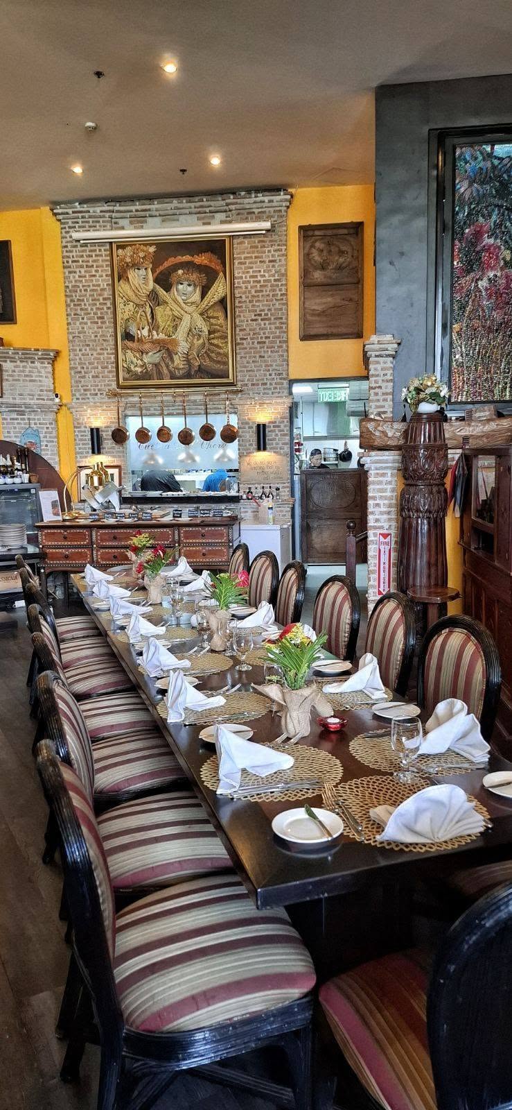 A long table set for lunch at L’Opera, from its August 2026 photography