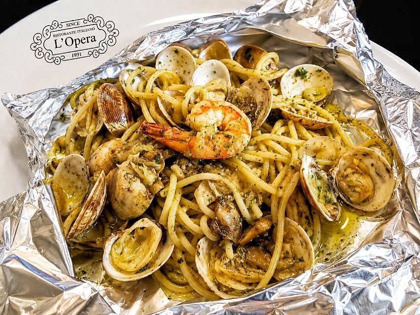 Spaghetti Mare e Monti al Cartoccio from L’Opera’s July 2026 post